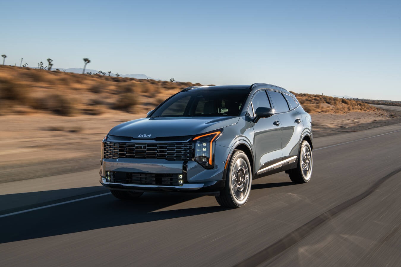 2026 Kia Sportage hybrid, front 3/4 in action. Image courtesy of Kia.