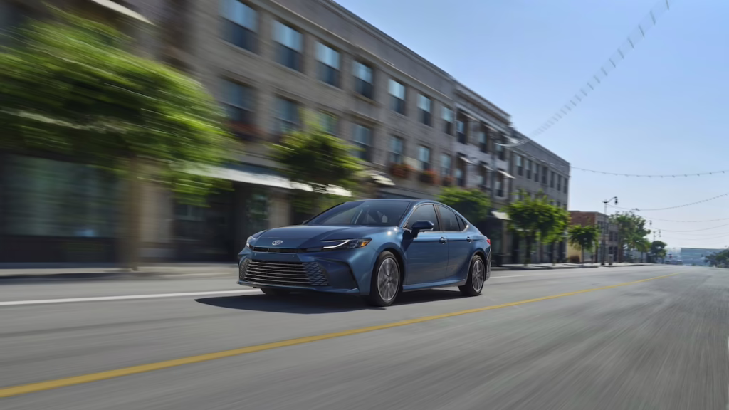 2026 Toyota Camry XLE. Front 3/4 in action. Image courtesy of Toyota.