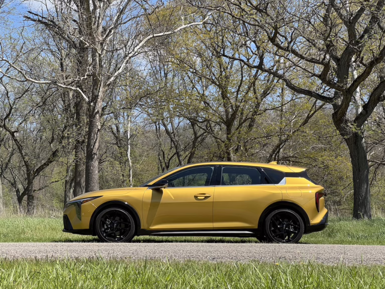 2026 Kia K4 hatchback GT Line Turbo, sparkling yellow, in profile. Image by Robin Warner