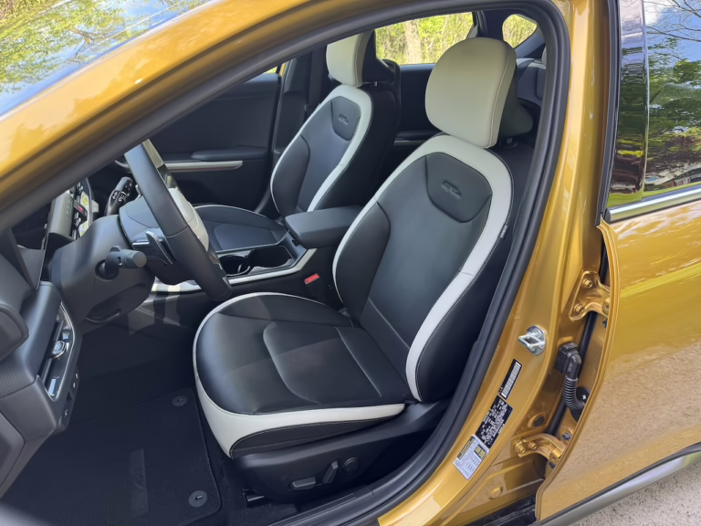 2026 Kia K4 hatchback GT Line Turbo, sparkling yellow, front seat. Image by Robin Warner